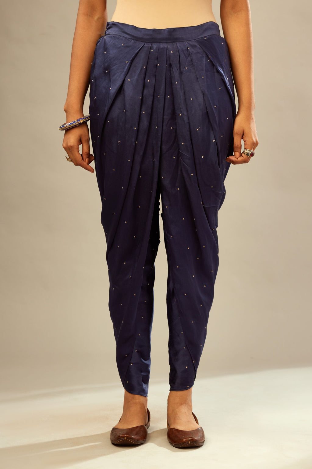 Navy blue silk dhoti with all over small flower embroidery.