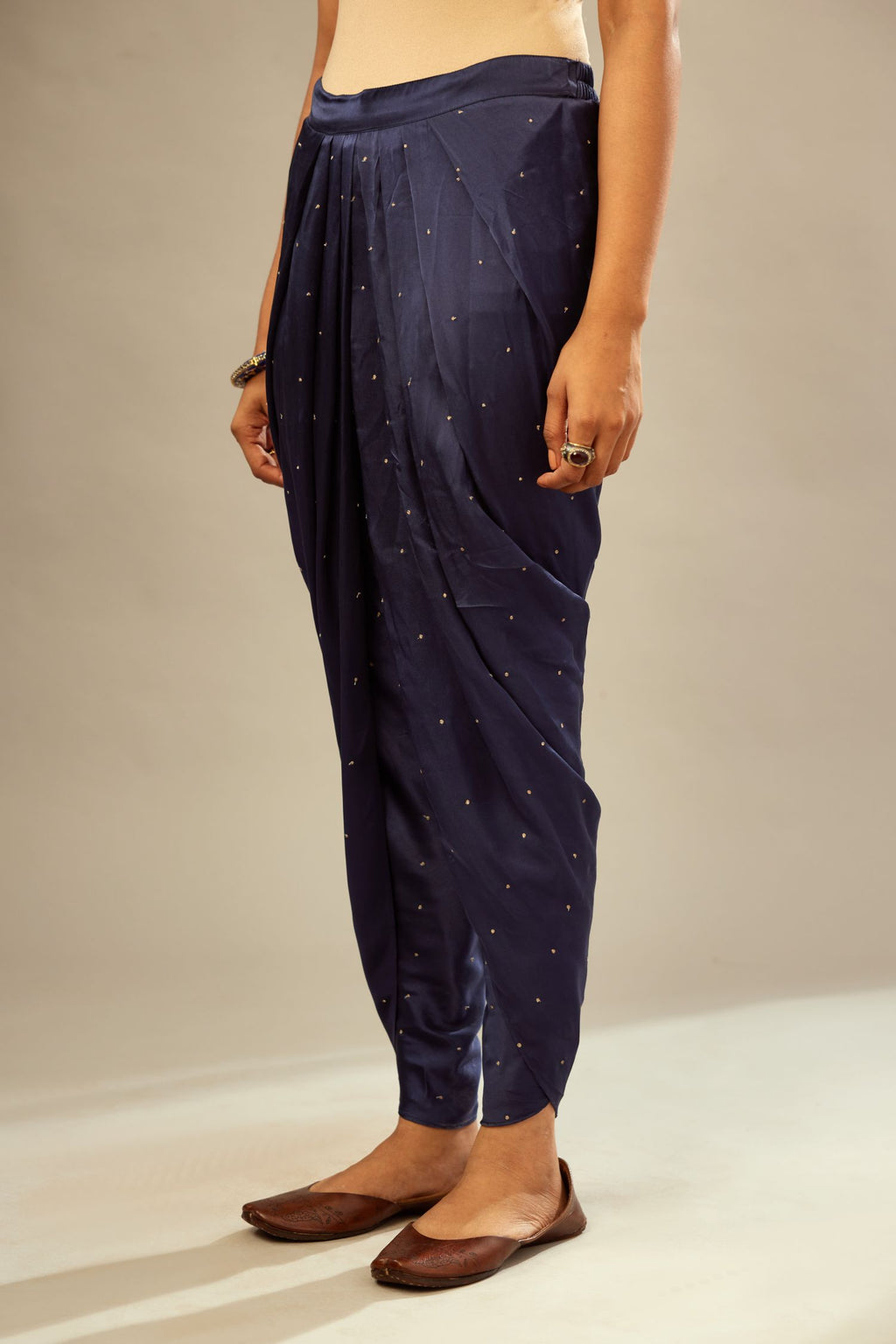 Navy blue silk dhoti with all over small flower embroidery.