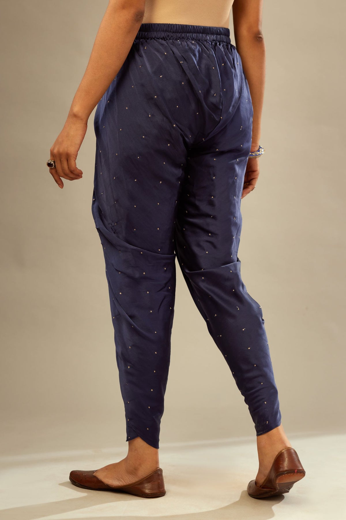 Navy blue silk dhoti with all over small flower embroidery.