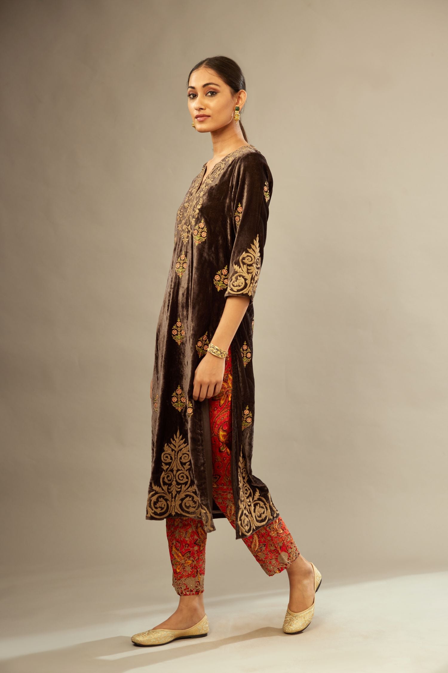 Grey silk velvet lined kurta set with light gold dori embroidery and contrast colored boota all-over the kurta.