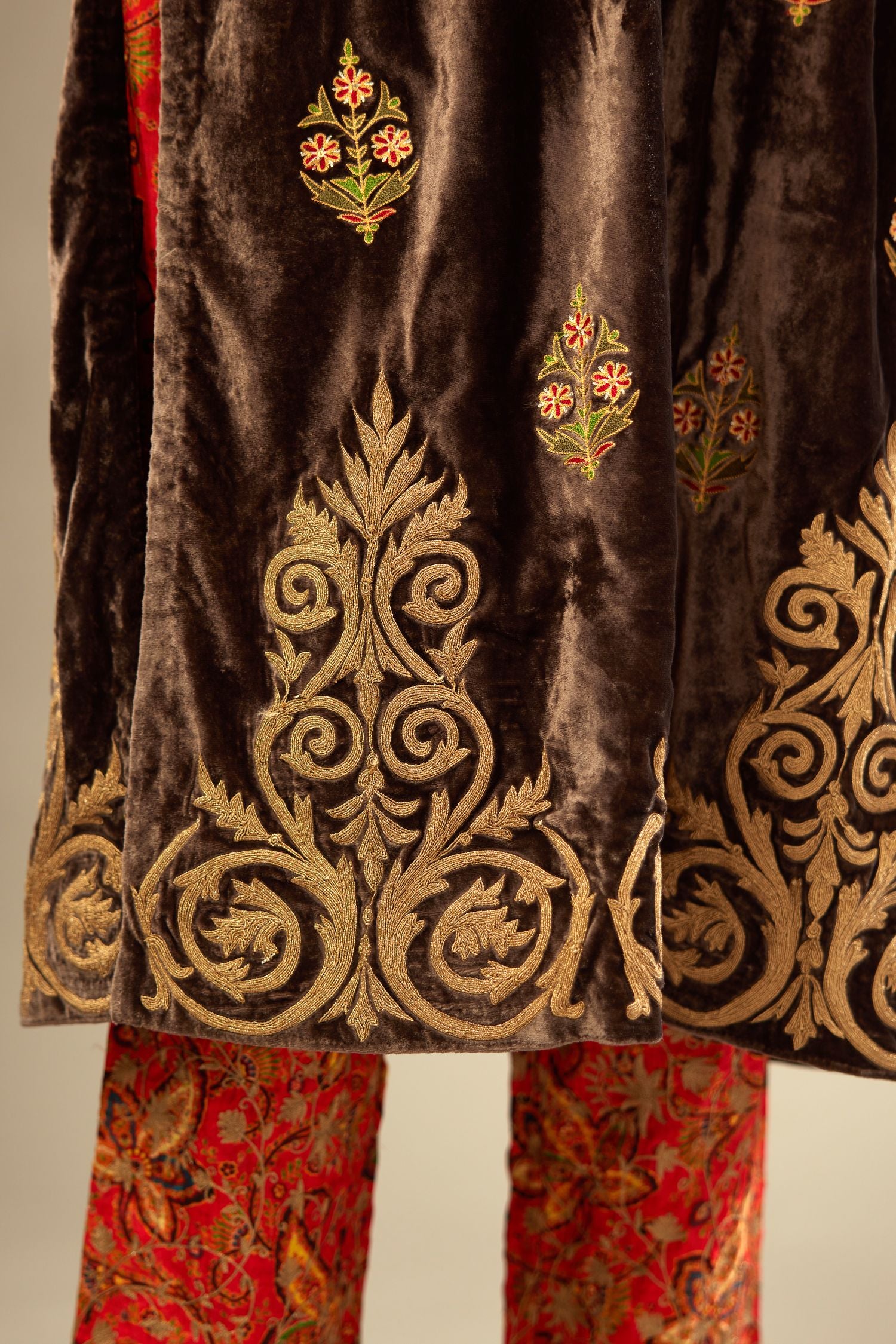 Grey silk velvet lined kurta set with light gold dori embroidery and contrast colored boota all-over the kurta.