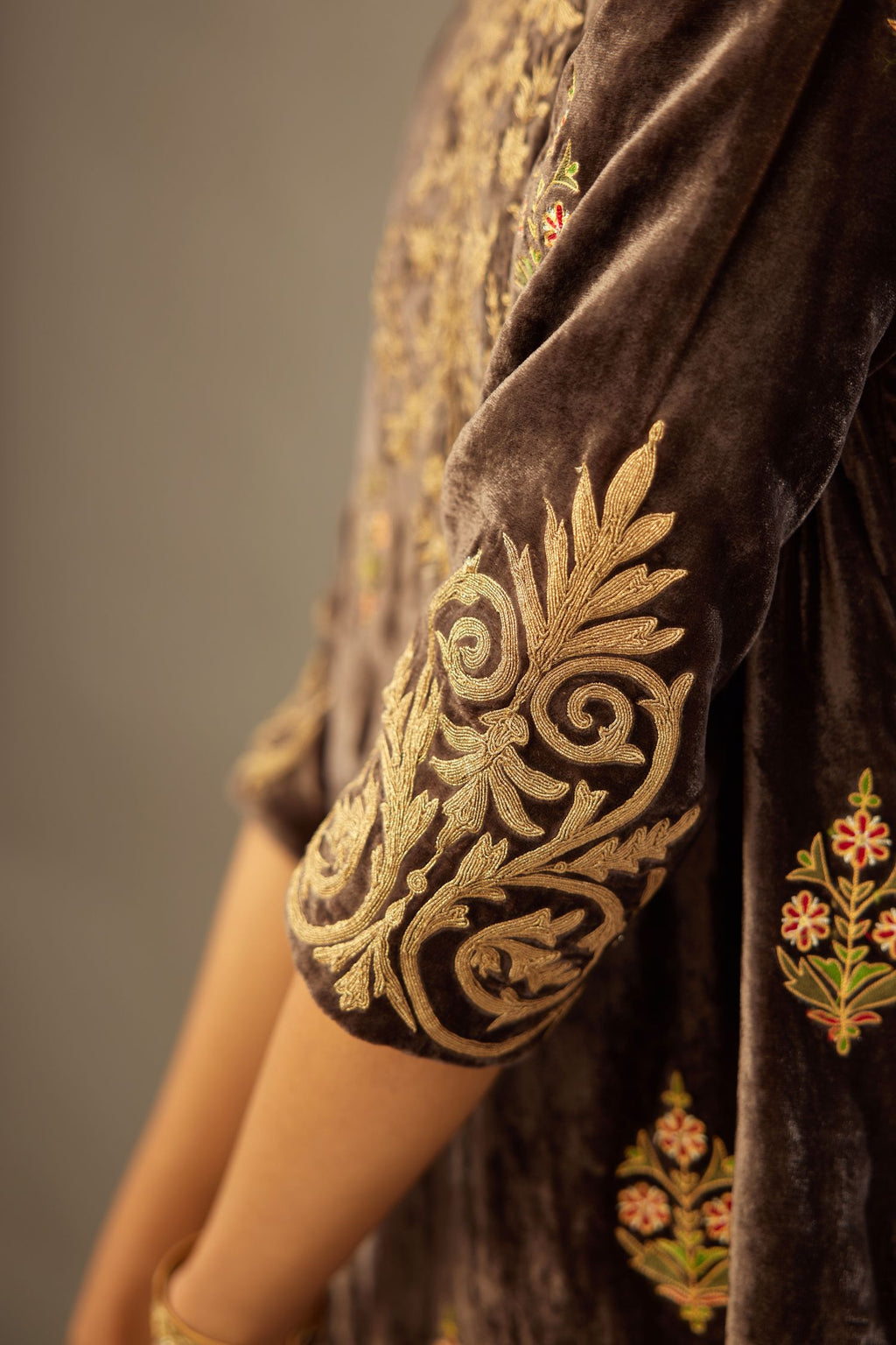Grey silk velvet lined kurta set with light gold dori embroidery and contrast colored boota all-over the kurta.