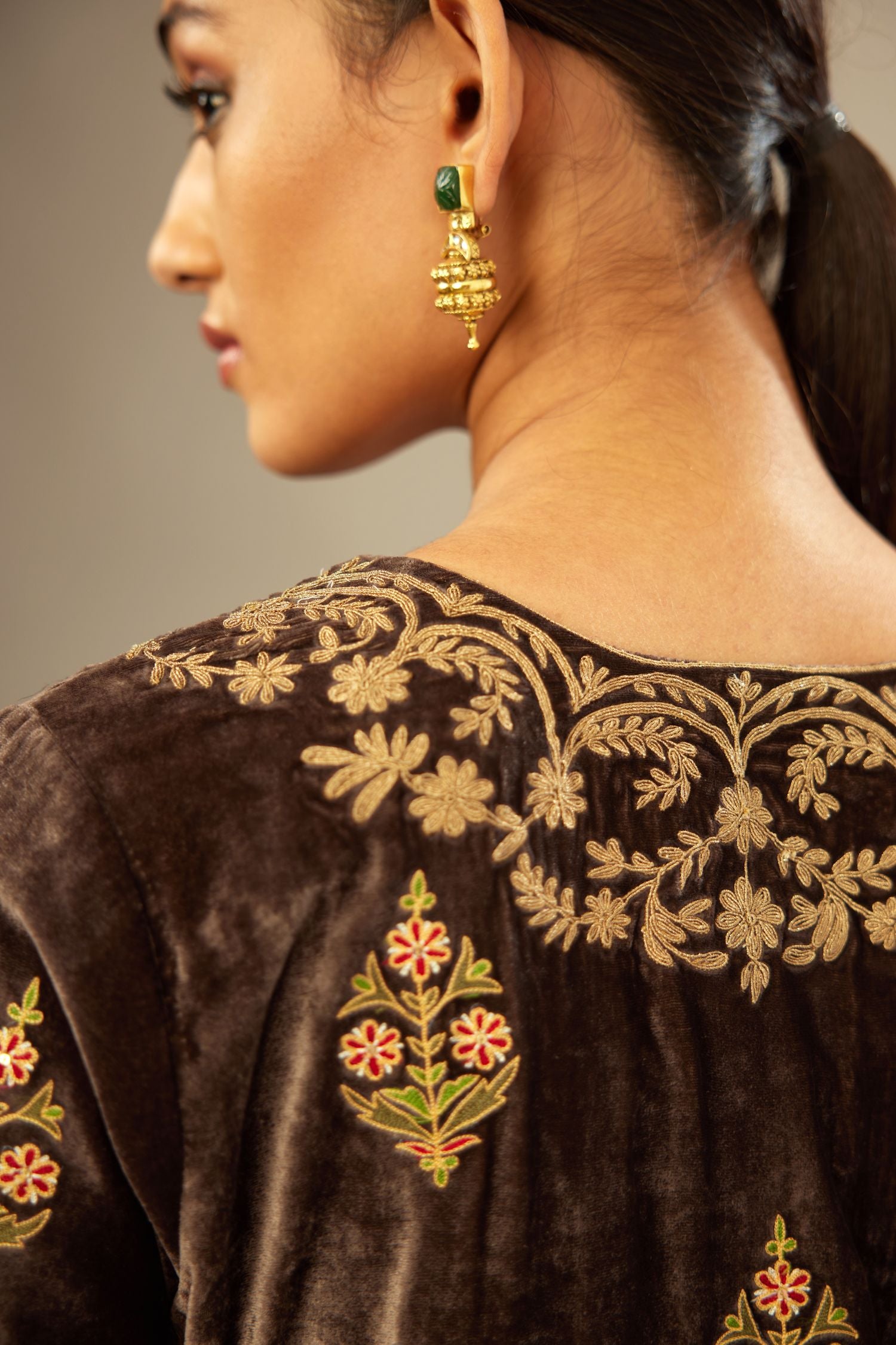 Grey silk velvet lined kurta set with light gold dori embroidery and contrast colored boota all-over the kurta.