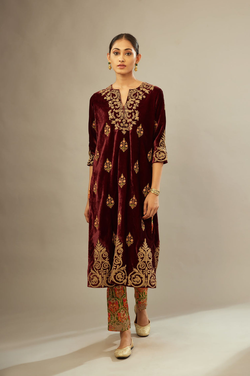 Marron silk velvet lined kurta set with light gold dori embroidery and contrast colored boota all-over the kurta.