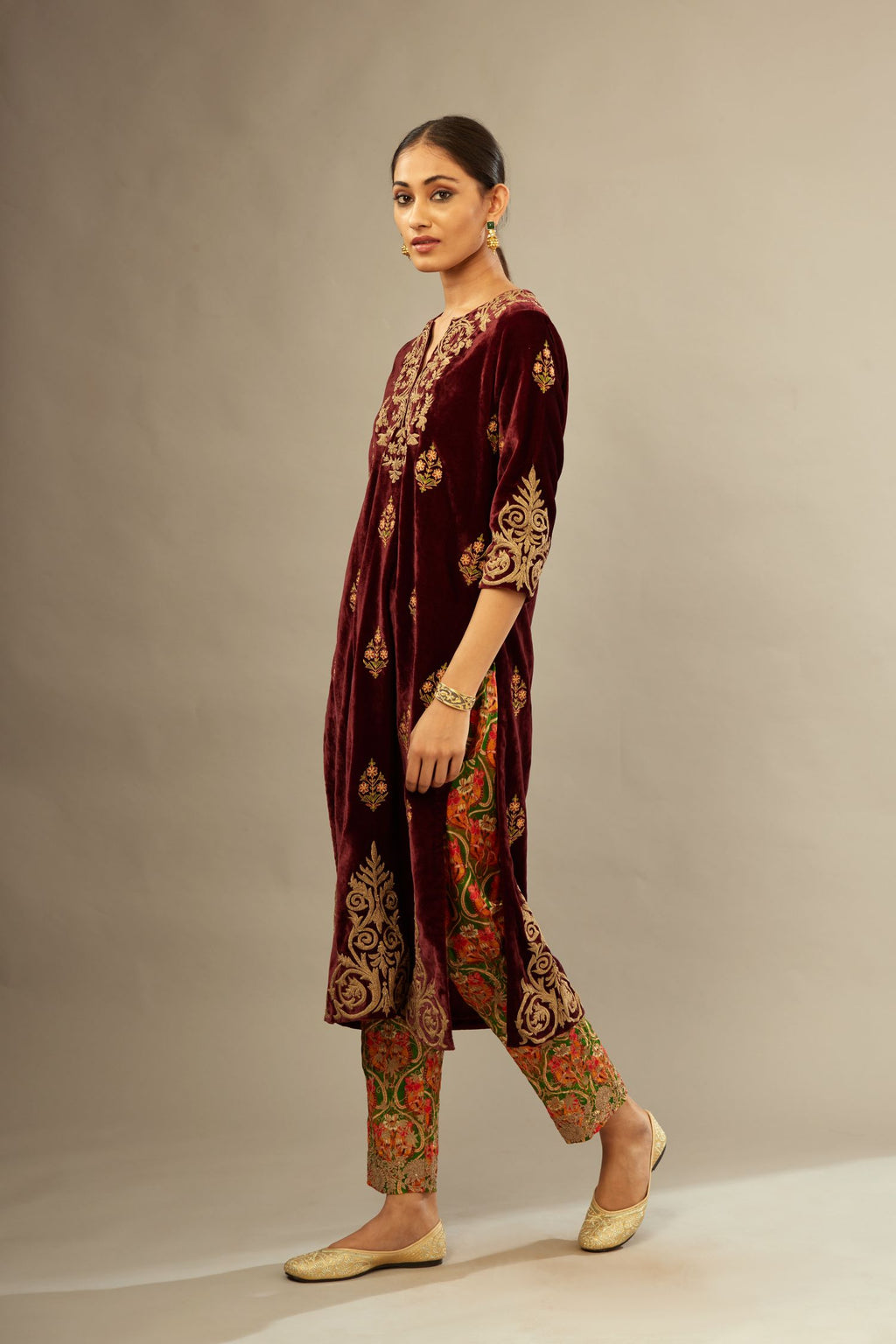 Marron silk velvet lined kurta set with light gold dori embroidery and contrast colored boota all-over the kurta.