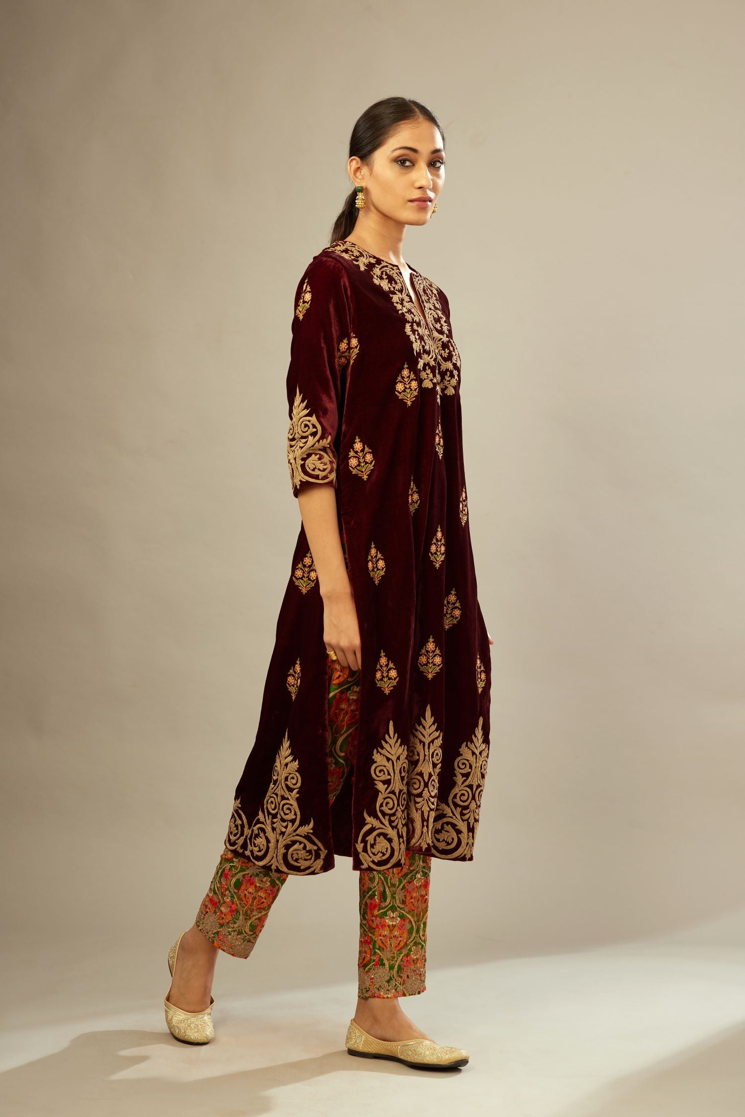 Marron silk velvet lined kurta set with light gold dori embroidery and contrast colored boota all-over the kurta.