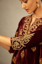 Marron silk velvet lined kurta set with light gold dori embroidery and contrast colored boota all-over the kurta.