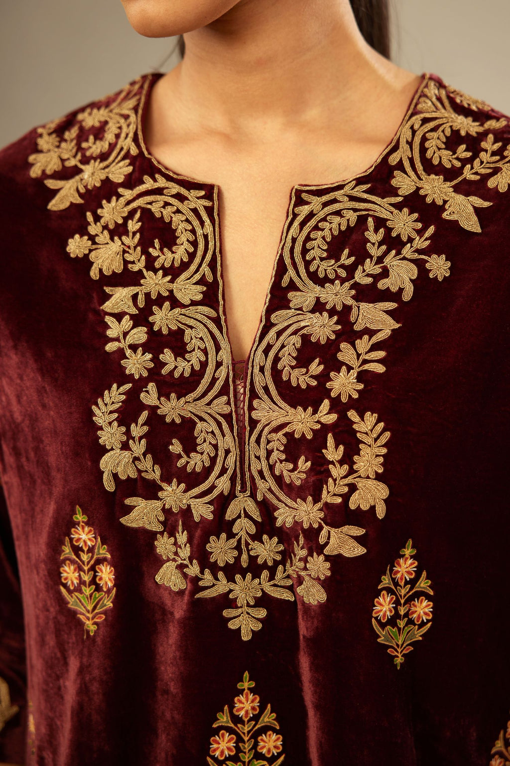 Marron silk velvet lined kurta set with light gold dori embroidery and contrast colored boota all-over the kurta.
