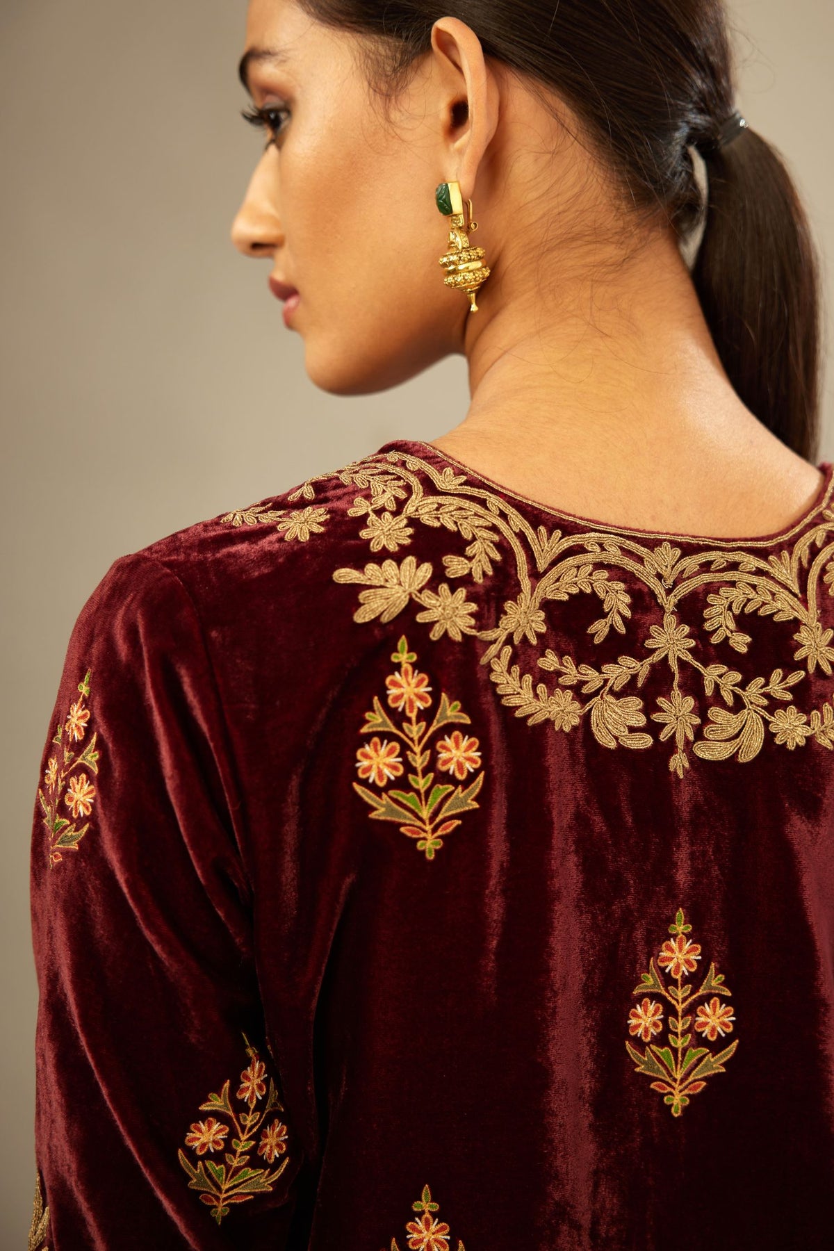 Marron silk velvet lined kurta set with light gold dori embroidery and contrast colored boota all-over the kurta.
