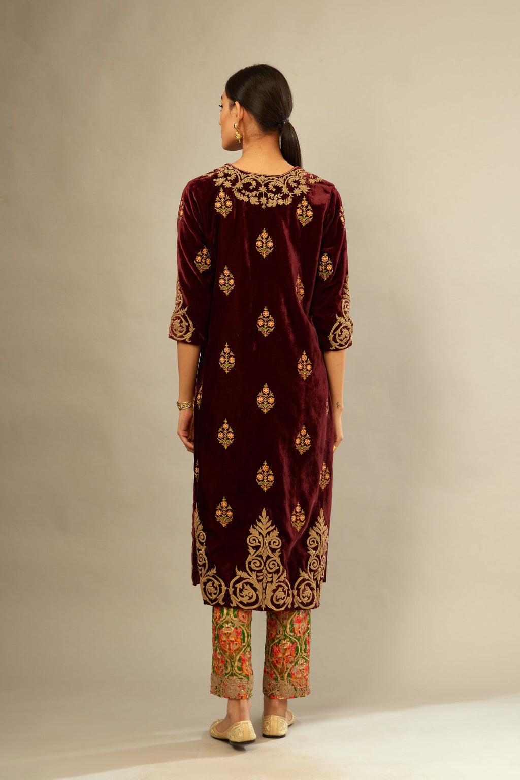 Marron silk velvet lined kurta set with light gold dori embroidery and contrast colored boota all-over the kurta.