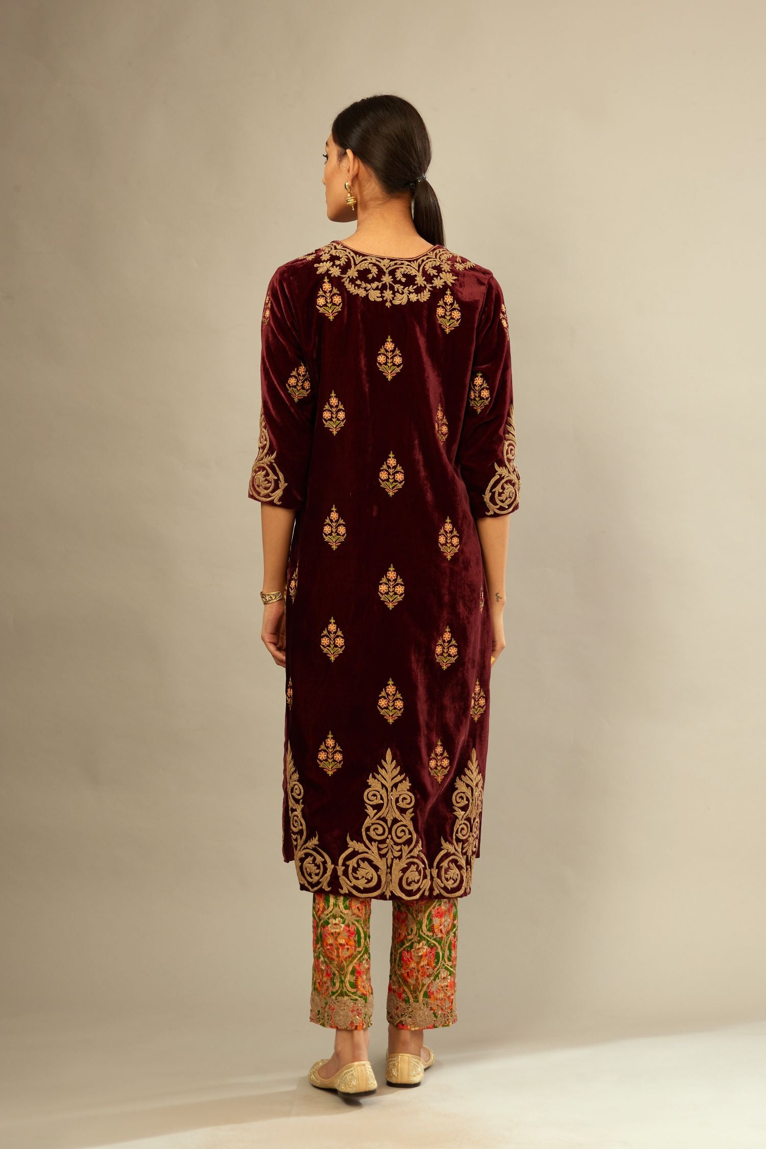 Marron silk velvet lined kurta set with light gold dori embroidery and contrast colored boota all-over the kurta.