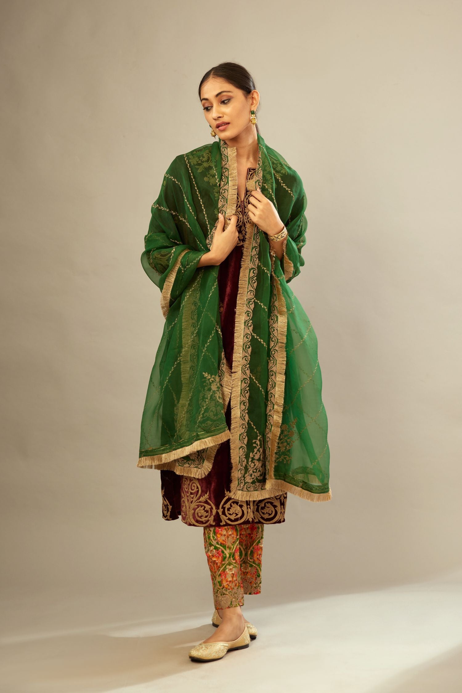 Marron silk velvet lined kurta set with light gold dori embroidery and contrast colored boota all-over the kurta.