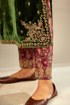 Green silk velvet kurta set with small embroidered zari buties all-over the kurta and detailed with dori embroidery at neck, sleeves, side slits and hem.