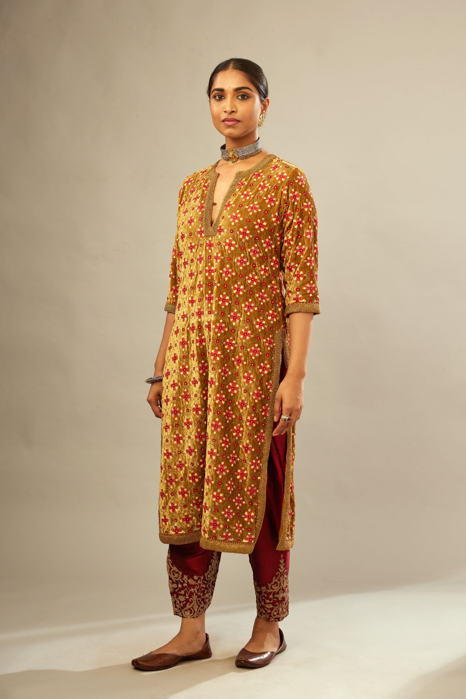 Mustard yellow silk velvet straight kurta set with full jaal silk thread embroidery. This kurta is detailed with zardosi farisha work.