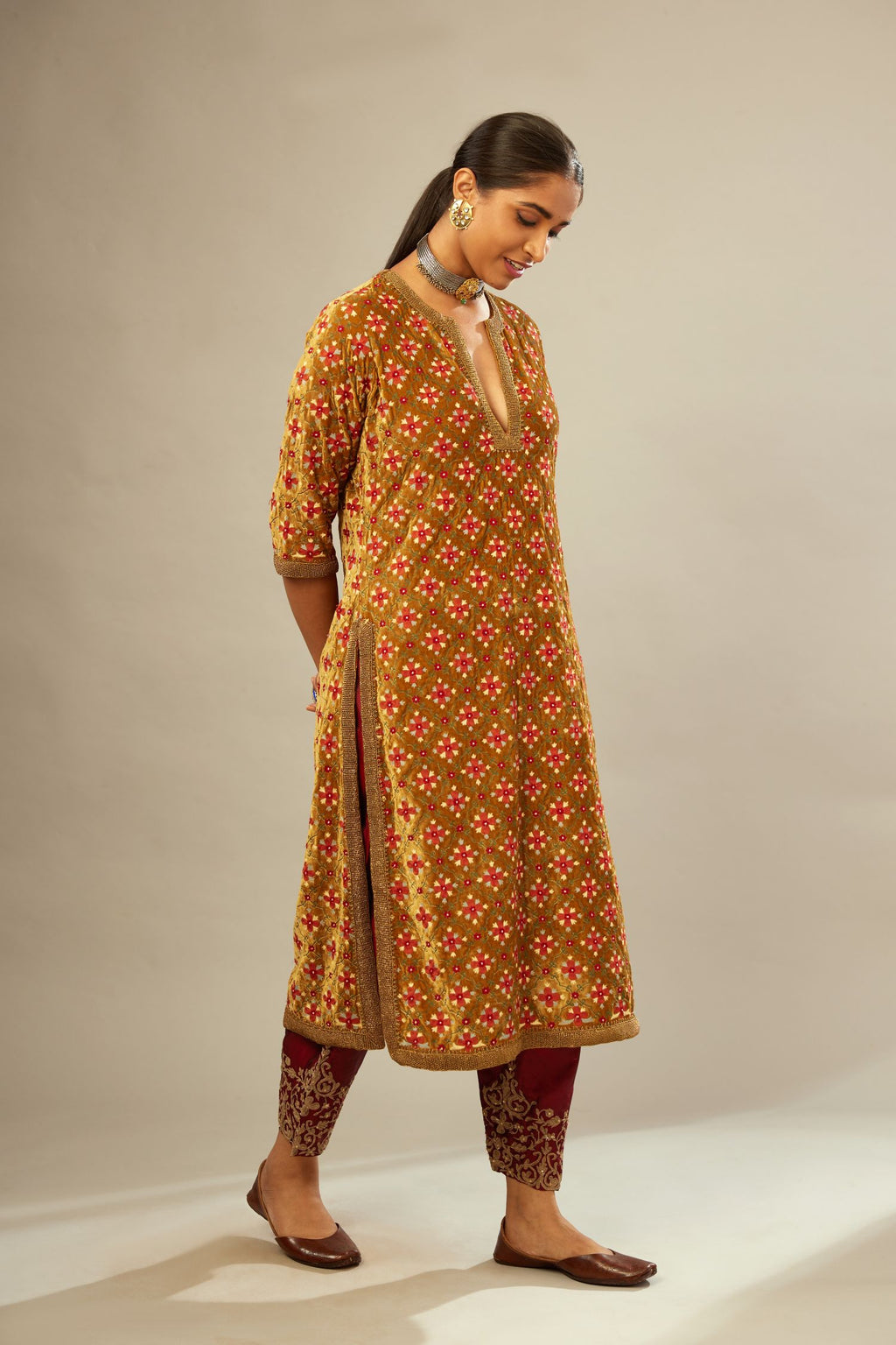 Mustard yellow silk velvet straight kurta set with full jaal silk thread embroidery. This kurta is detailed with zardosi farisha work.
