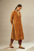 Mustard yellow silk velvet straight kurta set with full jaal silk thread embroidery. This kurta is detailed with zardosi farisha work.
