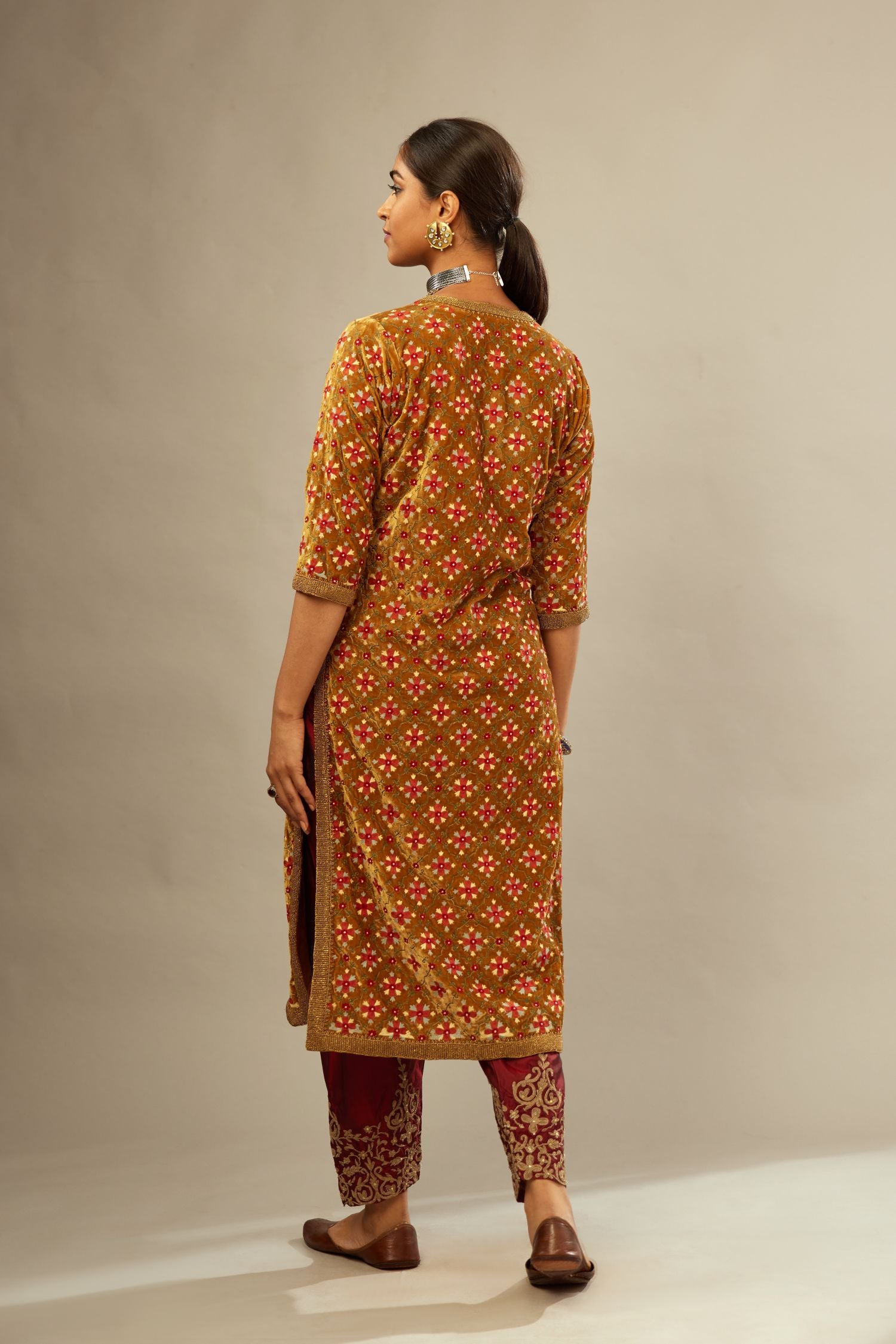 Mustard yellow silk velvet straight kurta set with full jaal silk thread embroidery. This kurta is detailed with zardosi farisha work.