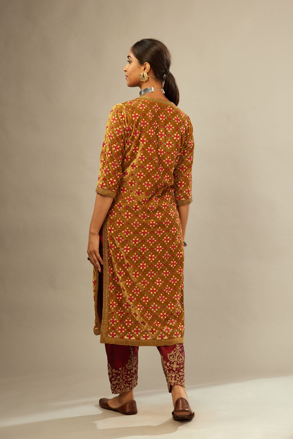 Mustard yellow silk velvet straight kurta set with full jaal silk thread embroidery. This kurta is detailed with zardosi farisha work.