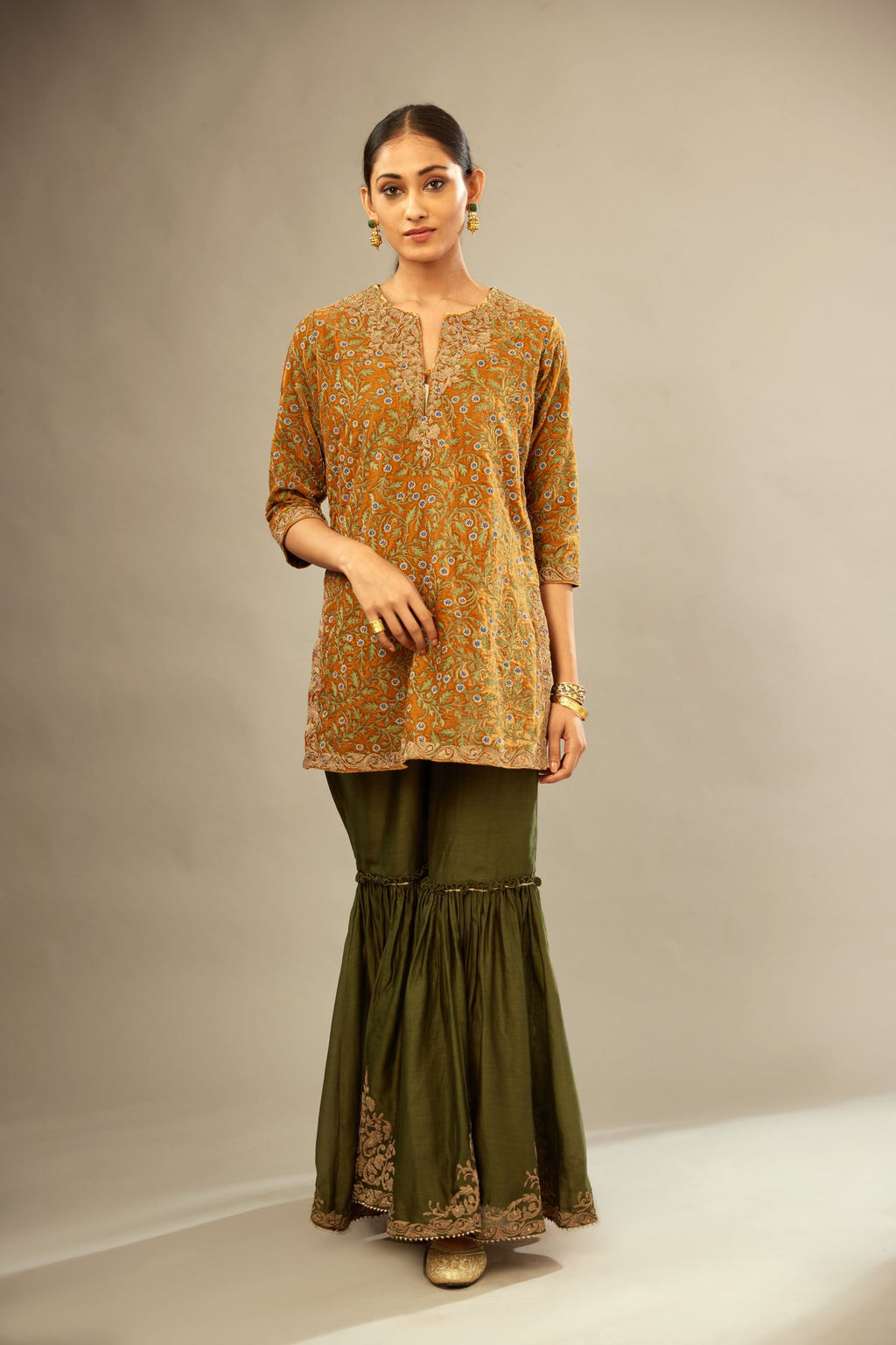 Mustard yellow silk velvet short kurta set with all-over silk thread jaal embroidery, detailed with gold dori embroidery.