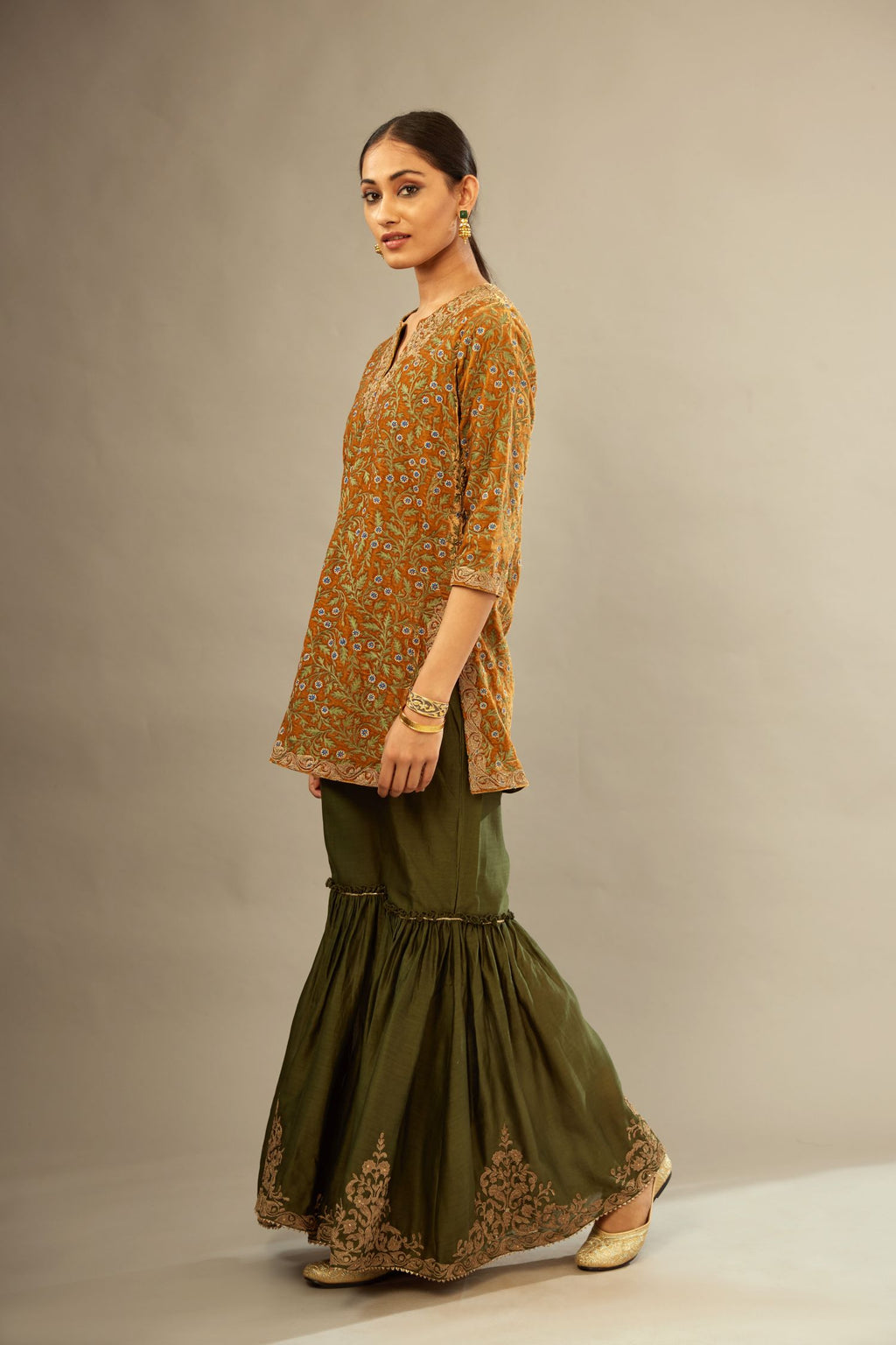 Mustard yellow silk velvet short kurta set with all-over silk thread jaal embroidery, detailed with gold dori embroidery.