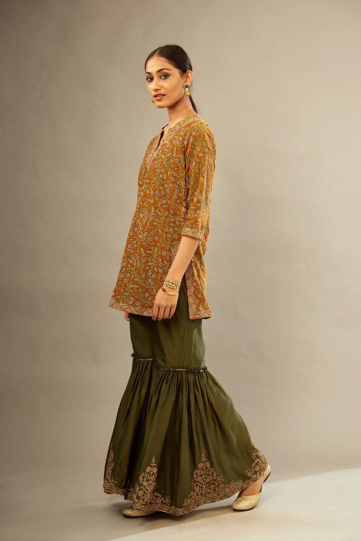 Mustard yellow silk velvet short kurta set with all-over silk thread jaal embroidery, detailed with gold dori embroidery.