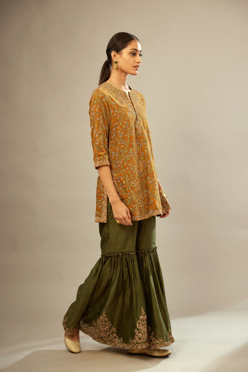 Mustard yellow silk velvet short kurta set with all-over silk thread jaal embroidery, detailed with gold dori embroidery.