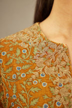 Mustard yellow silk velvet short kurta set with all-over silk thread jaal embroidery, detailed with gold dori embroidery.
