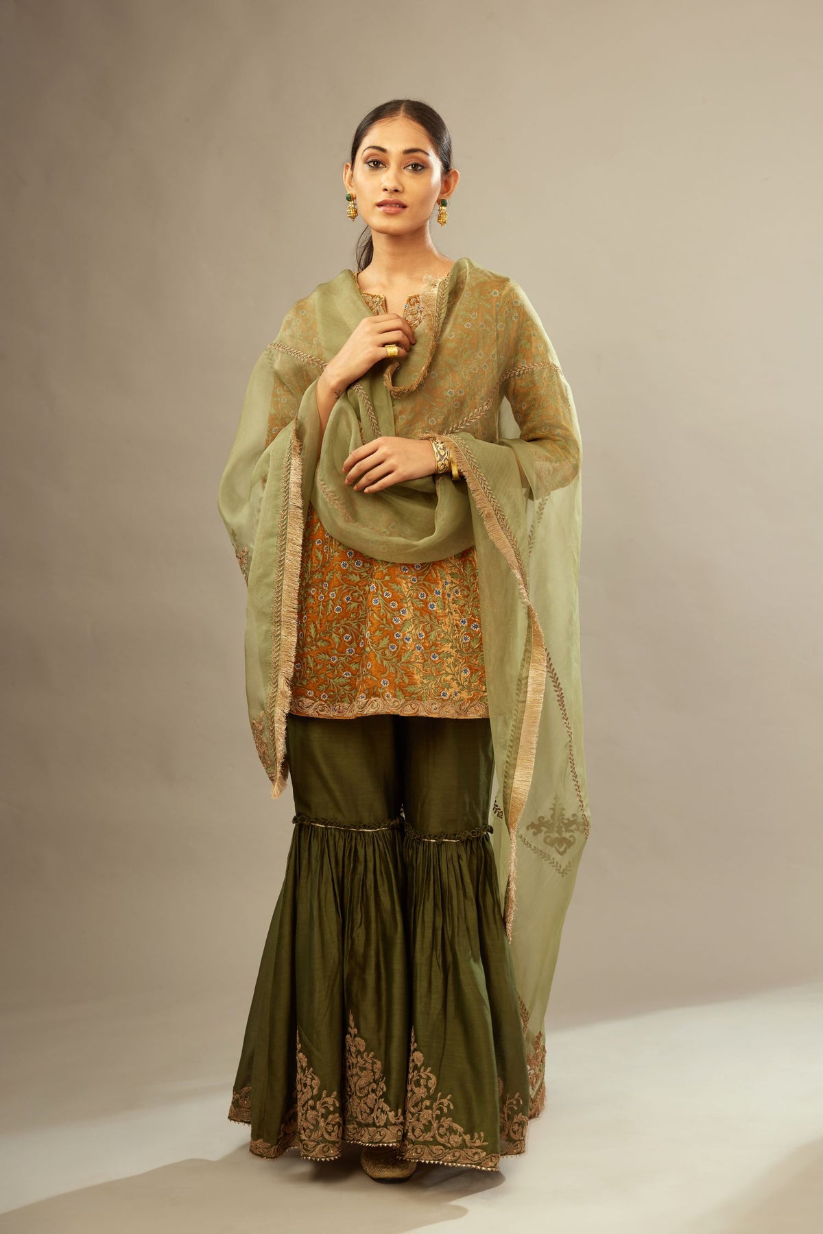Mustard yellow silk velvet short kurta set with all-over silk thread jaal embroidery, detailed with gold dori embroidery.
