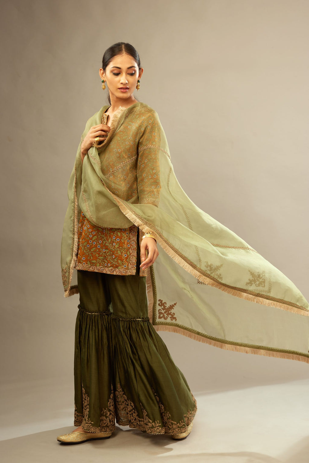 Mustard yellow silk velvet short kurta set with all-over silk thread jaal embroidery, detailed with gold dori embroidery.