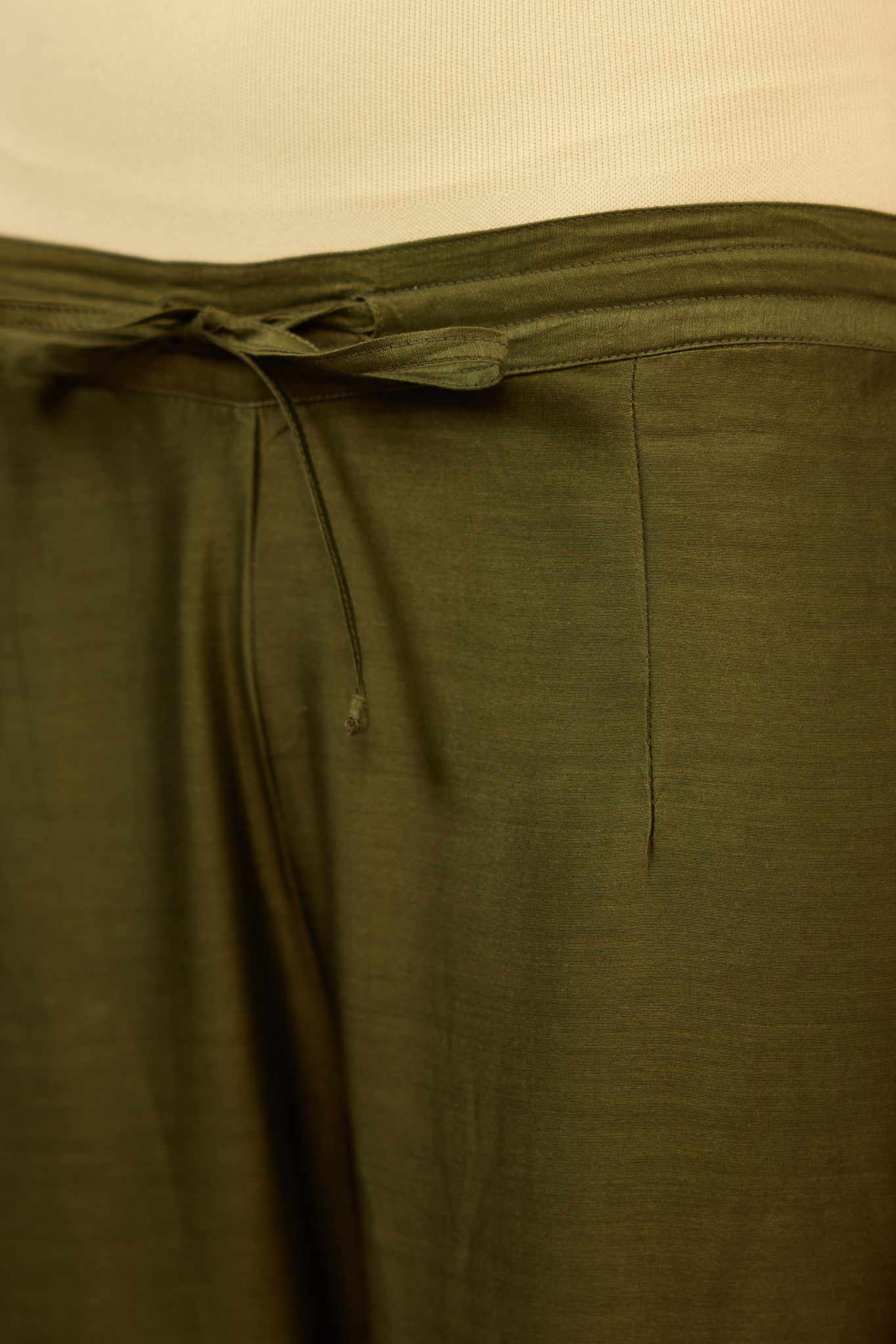 Olive silk chanderi farshi with gold dori embroidery and gota lace at hem.