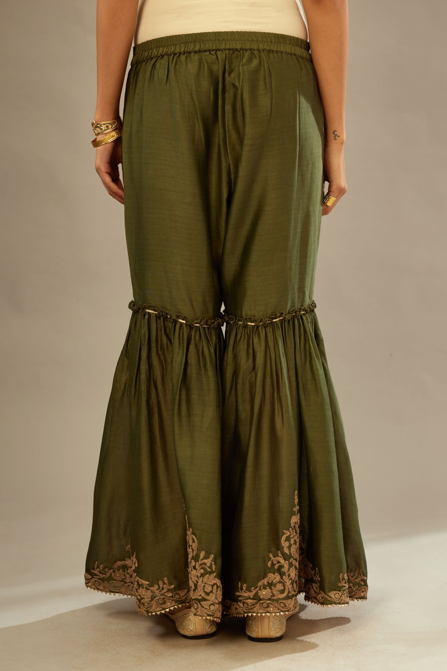 Olive silk chanderi farshi with gold dori embroidery and gota lace at hem.