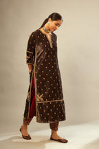Grey silk velvet straight kurta set with all-over delicate zari embroidered bootis, detailed with dori embroidery border at all edges.
