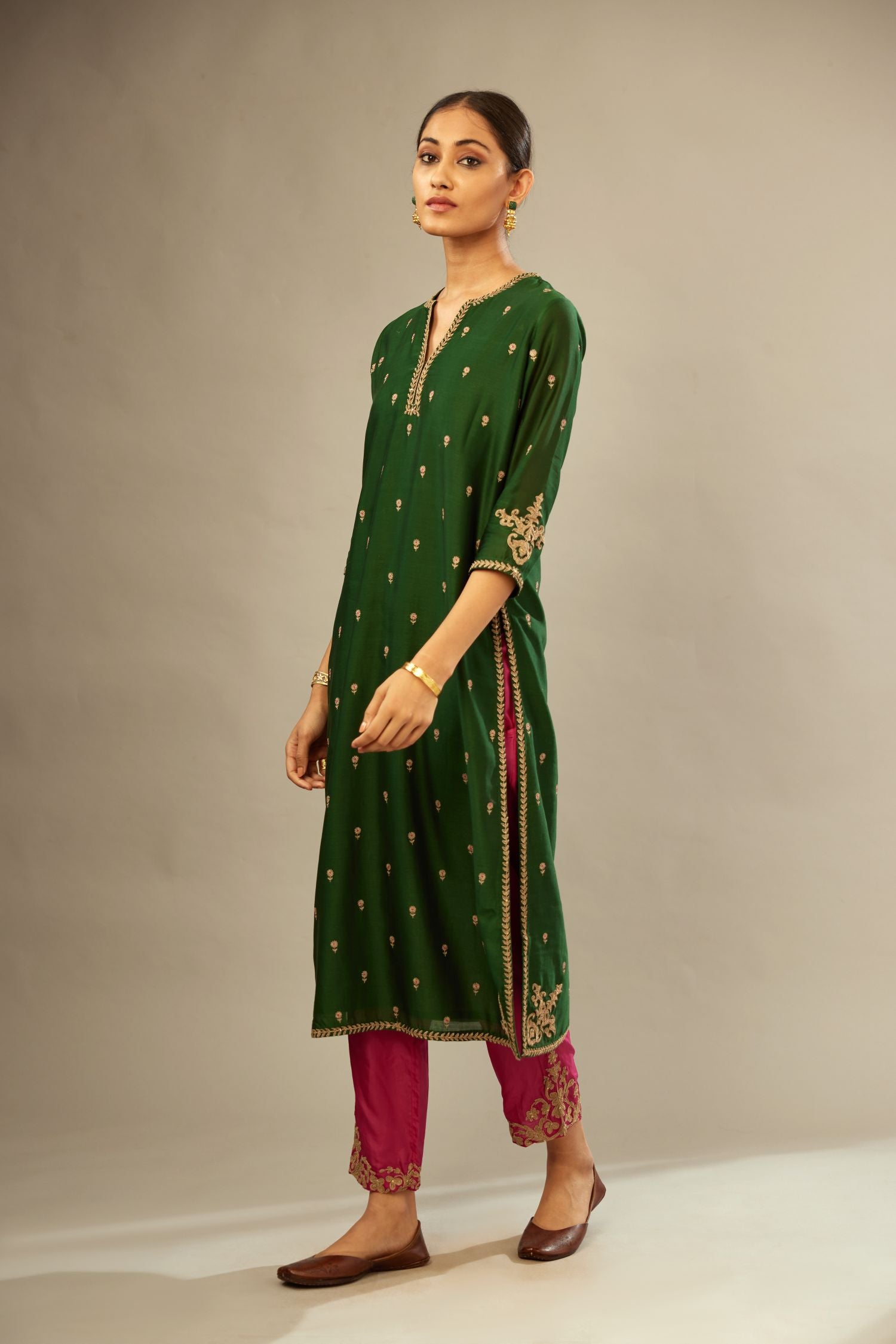 Green silk chanderi straight kurta set with gold dori embroidery, detailed with small aari embroidery buties all-over.