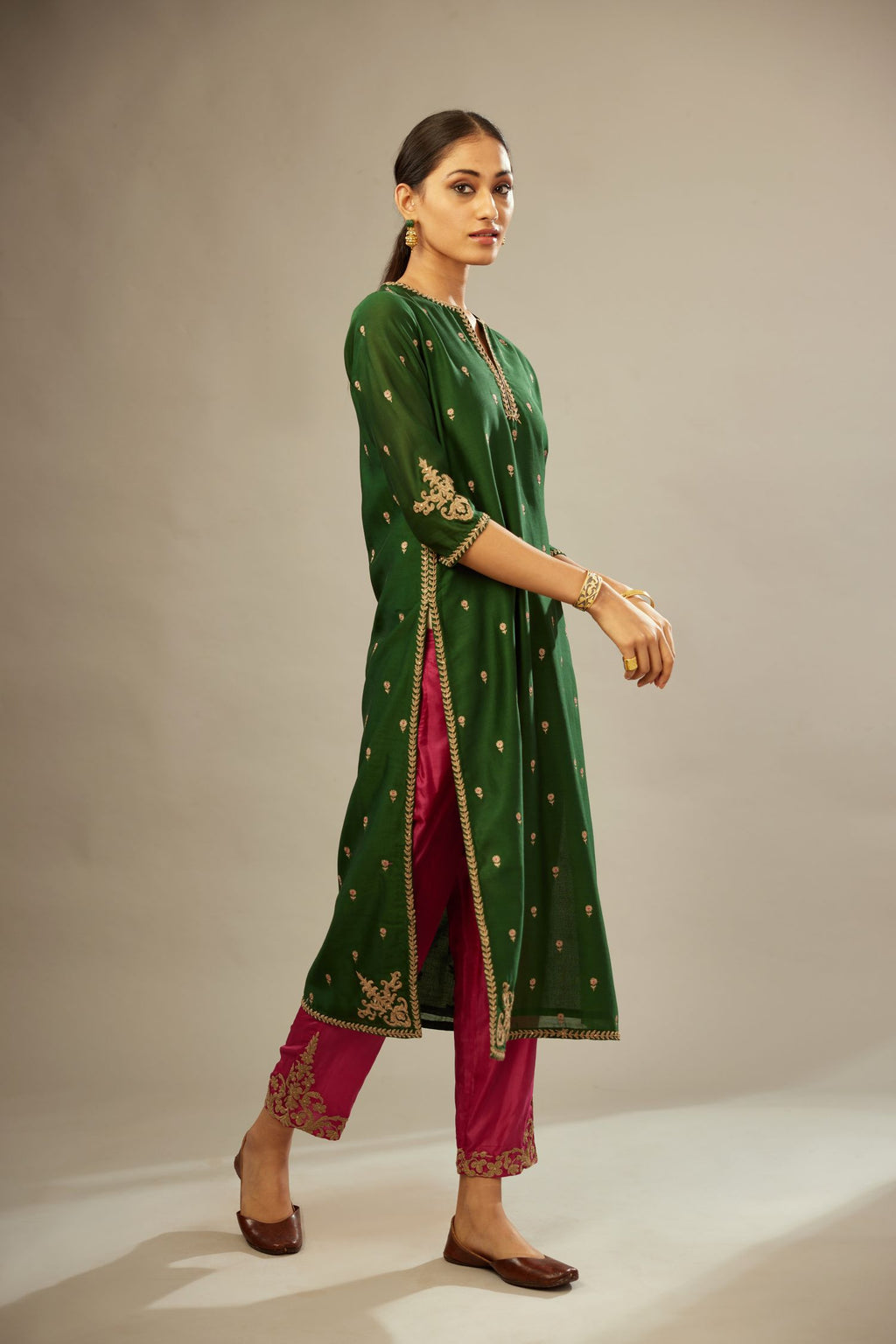 Green silk chanderi straight kurta set with gold dori embroidery, detailed with small aari embroidery buties all-over.