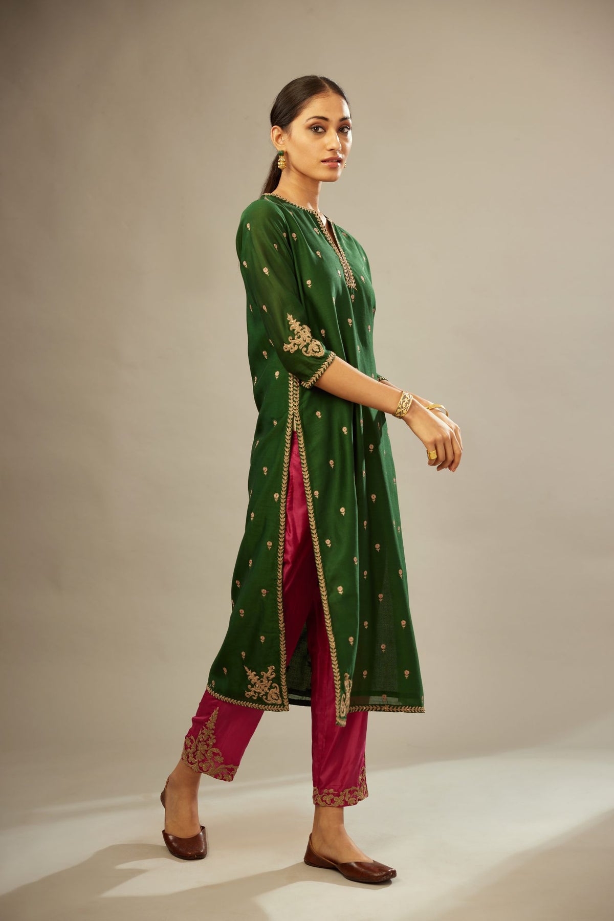 Green silk chanderi straight kurta set with gold dori embroidery, detailed with small aari embroidery buties all-over.