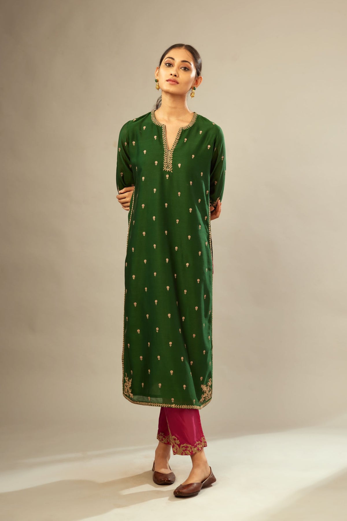 Green silk chanderi straight kurta set with gold dori embroidery, detailed with small aari embroidery buties all-over.