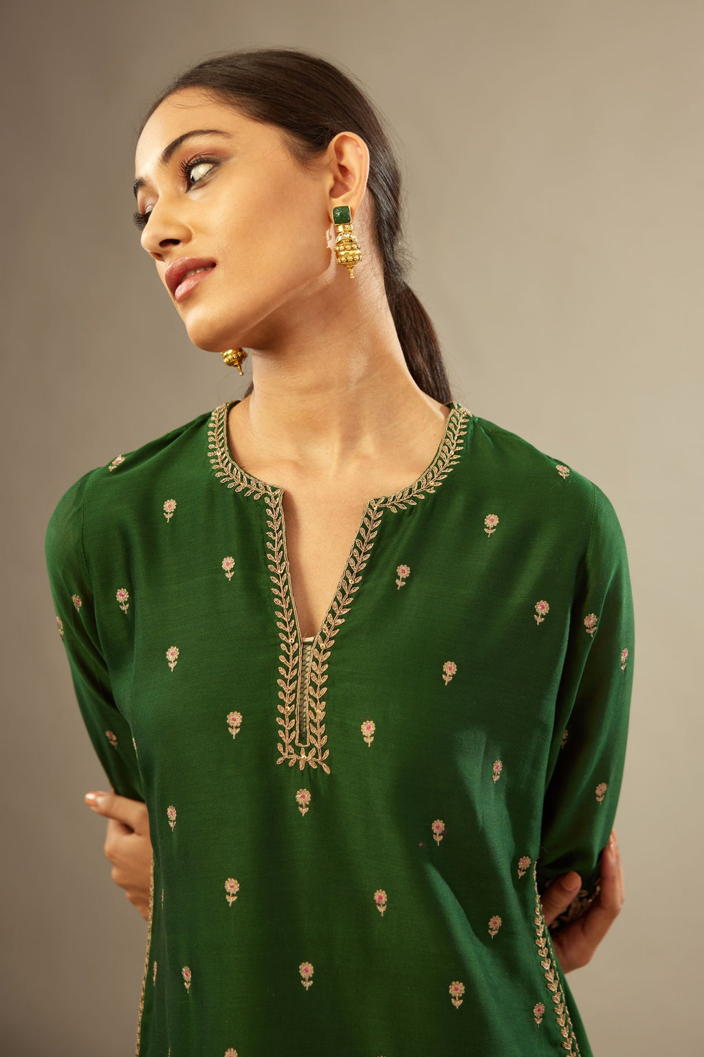 Green silk chanderi straight kurta set with gold dori embroidery, detailed with small aari embroidery buties all-over.