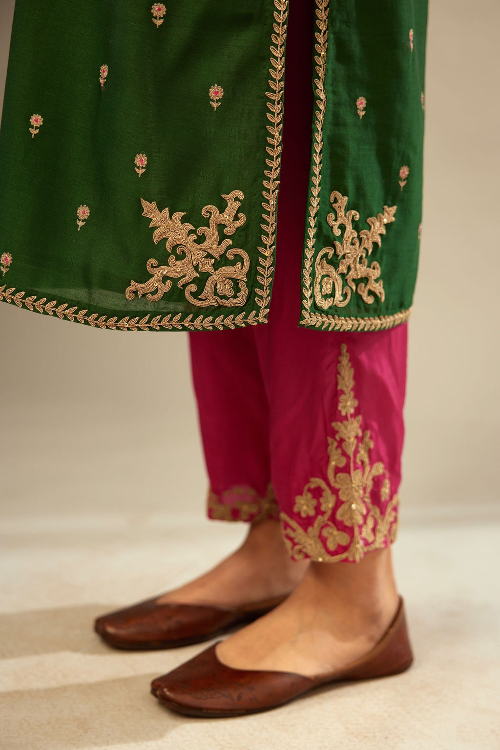 Green silk chanderi straight kurta set with gold dori embroidery, detailed with small aari embroidery buties all-over.