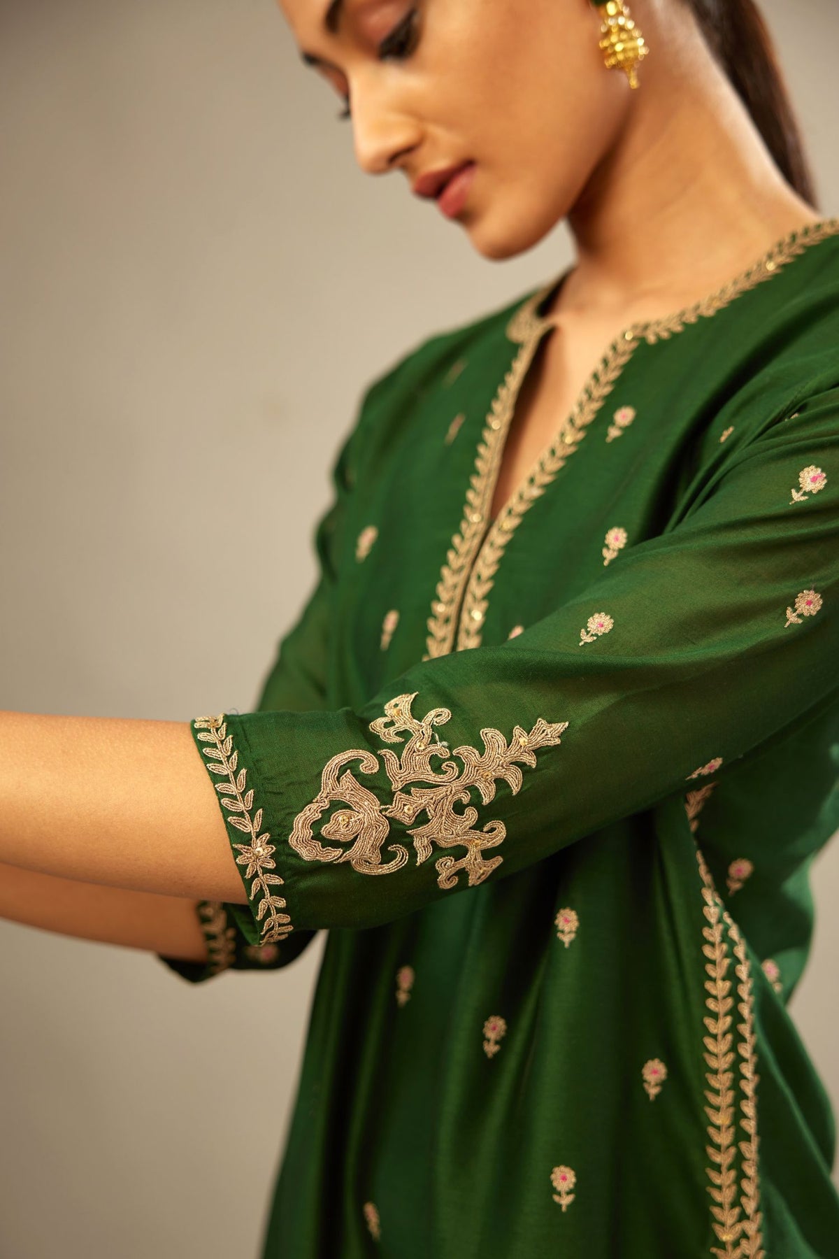 Green silk chanderi straight kurta set with gold dori embroidery, detailed with small aari embroidery buties all-over.
