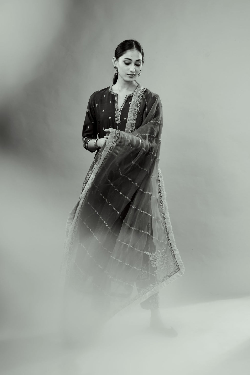 Green silk chanderi straight kurta set with gold dori embroidery, detailed with small aari embroidery buties all-over.