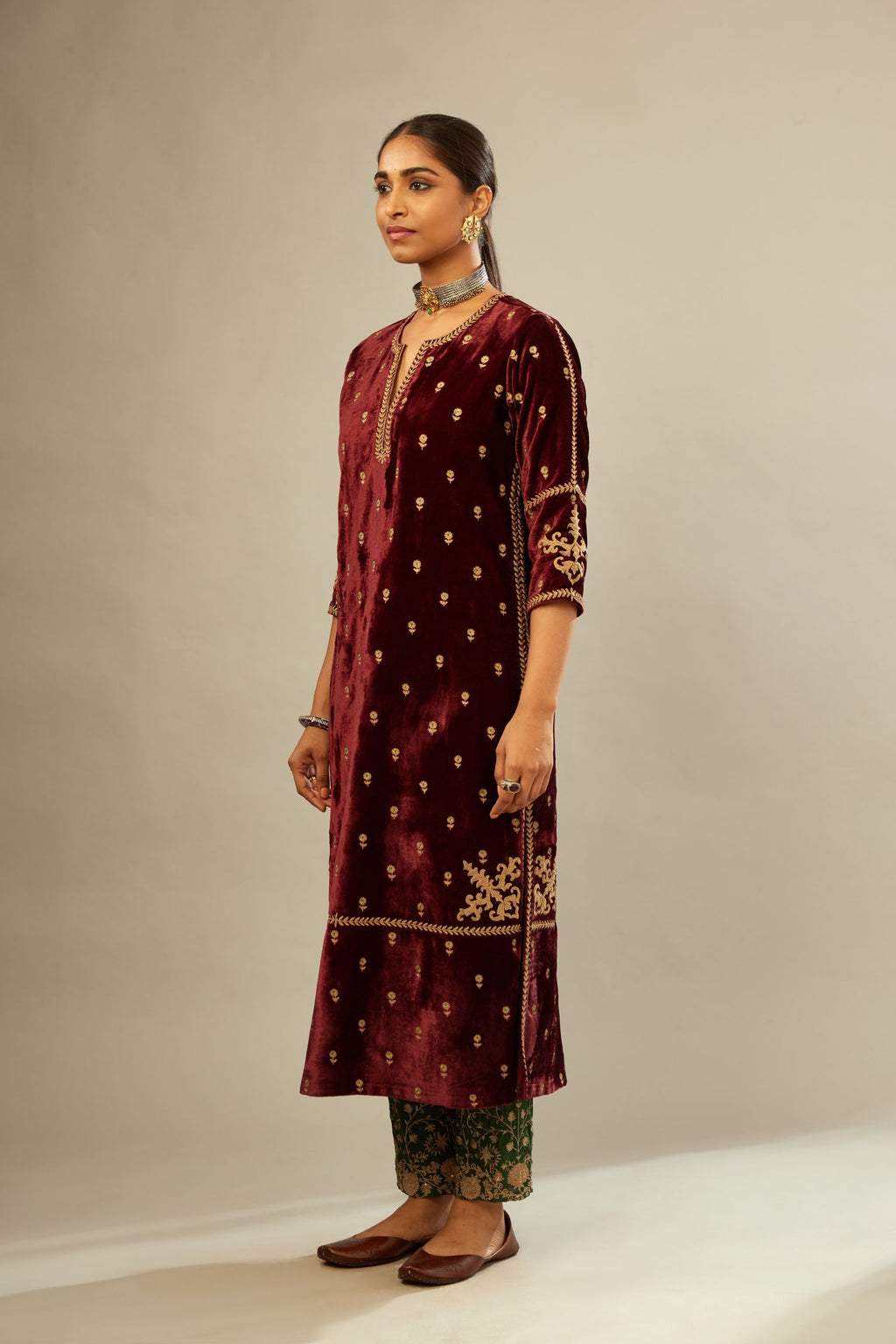 Maroon silk velvet straight kurta set with small zari embroidered booti all-over the kurta, detailed with dori embroidery border at edges