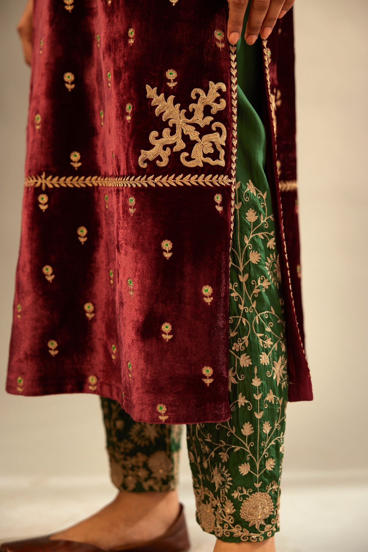 Maroon silk velvet straight kurta set with small zari embroidered booti all-over the kurta, detailed with dori embroidery border at edges