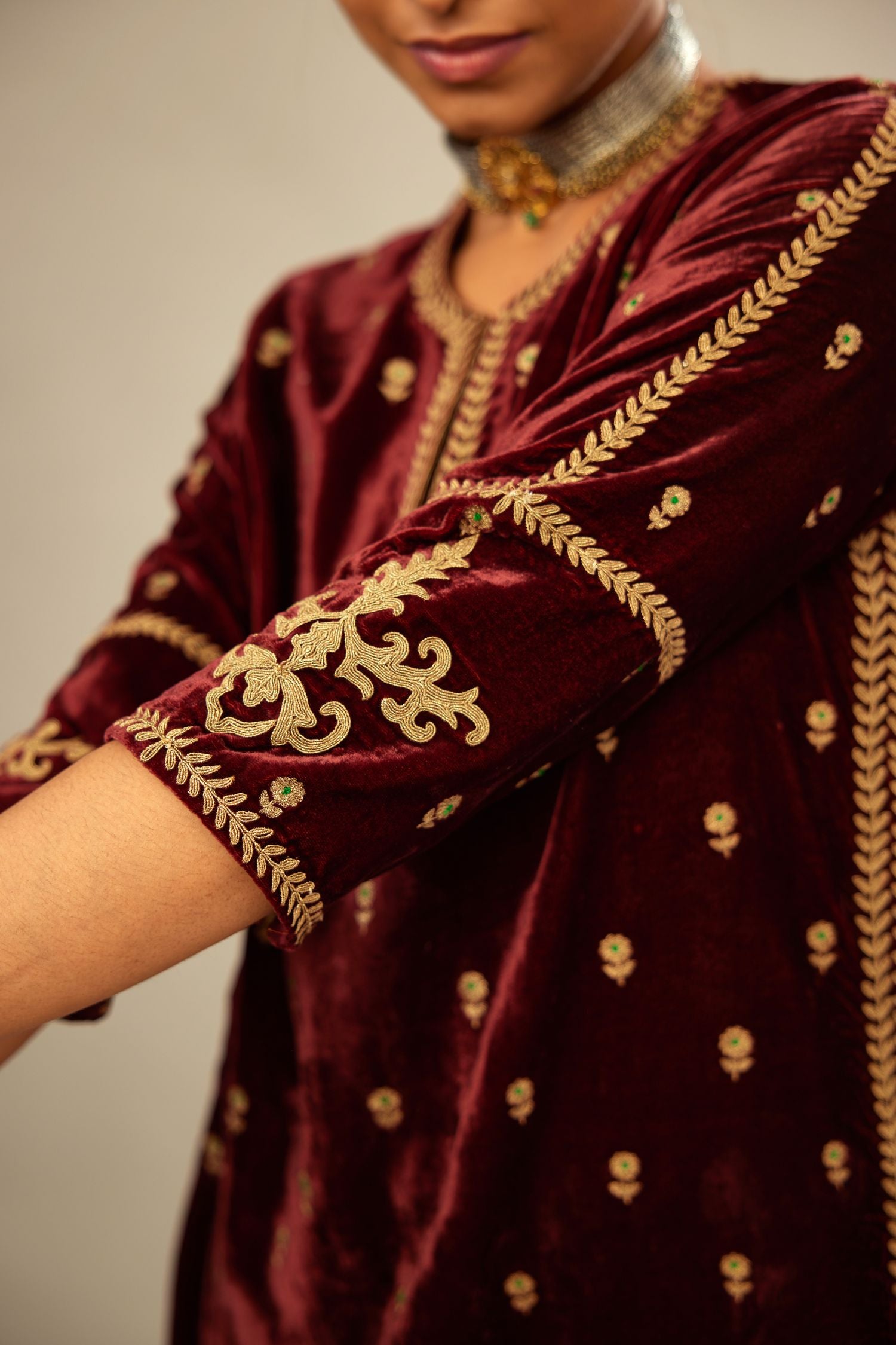 Maroon silk velvet straight kurta set with small zari embroidered booti all-over the kurta, detailed with dori embroidery border at edges
