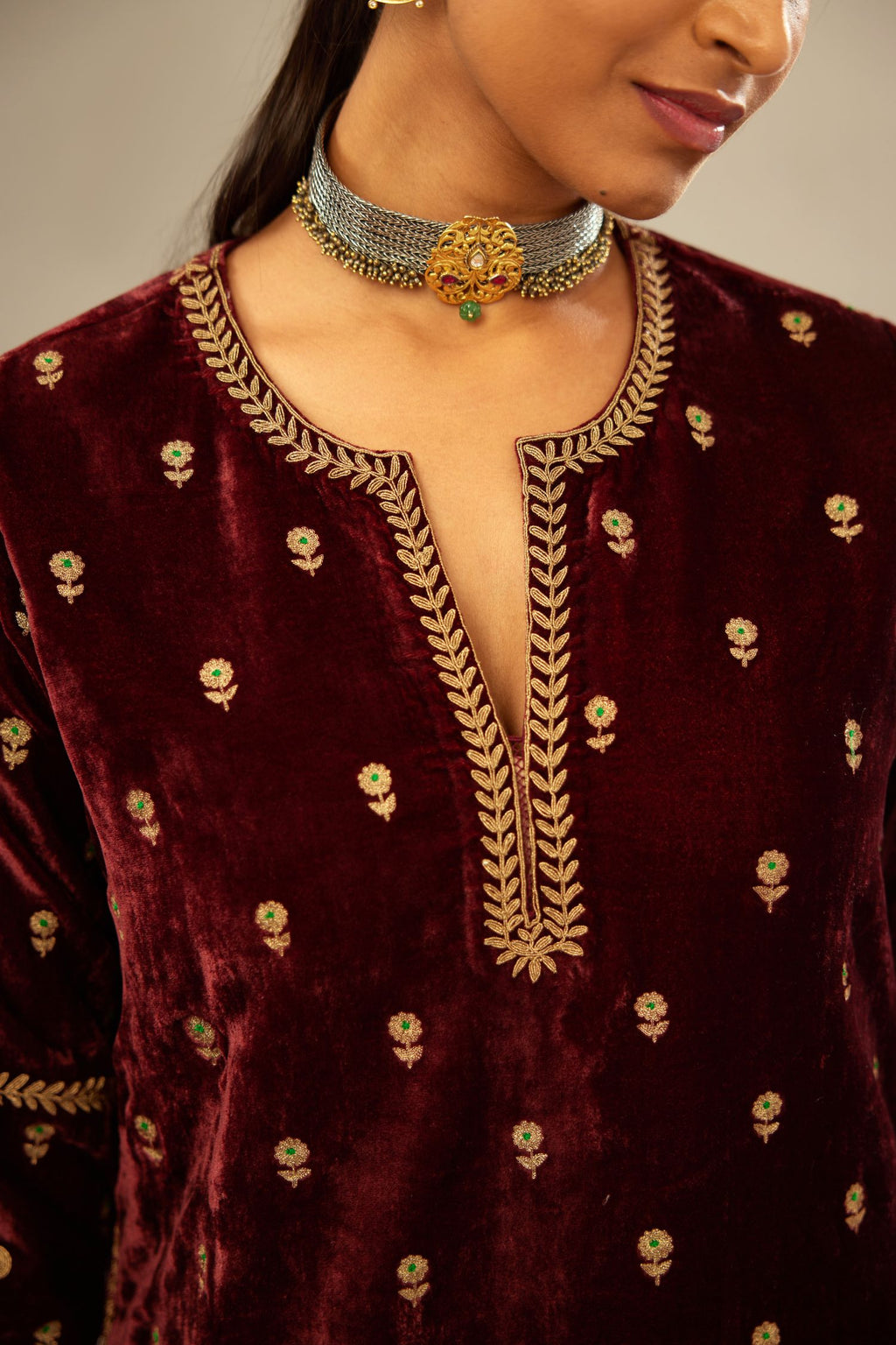 Maroon silk velvet straight kurta set with small zari embroidered booti all-over the kurta, detailed with dori embroidery border at edges