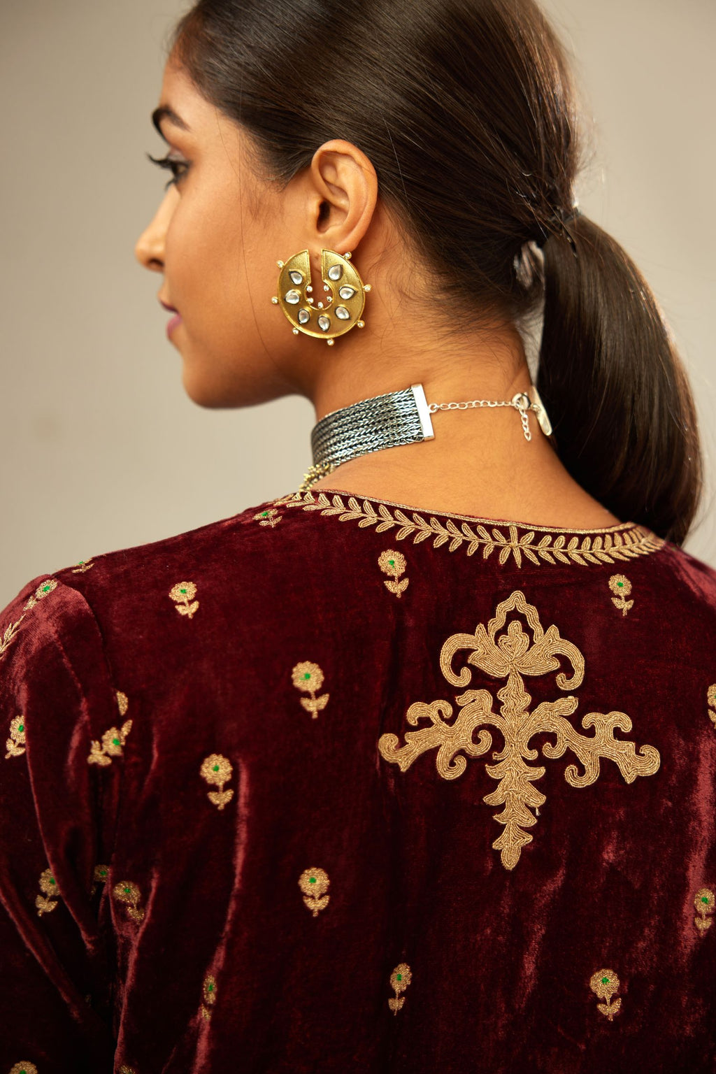Maroon silk velvet straight kurta set with small zari embroidered booti all-over the kurta, detailed with dori embroidery border at edges