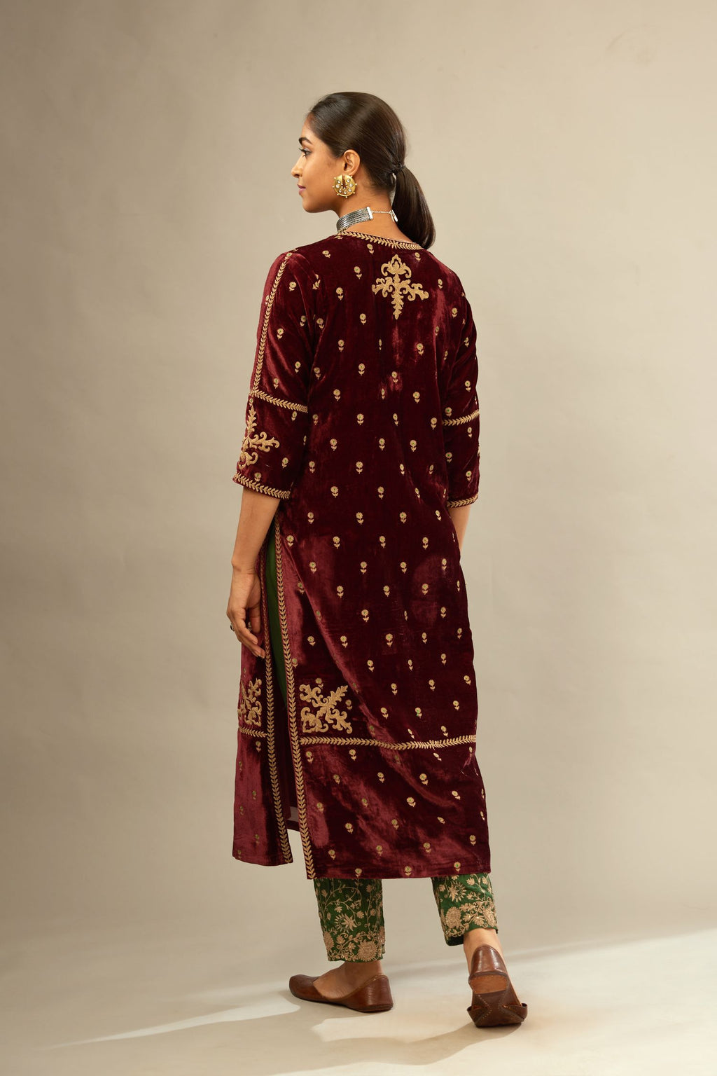 Maroon silk velvet straight kurta set with small zari embroidered booti all-over the kurta, detailed with dori embroidery border at edges