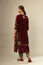 Maroon silk velvet straight kurta set with small zari embroidered booti all-over the kurta, detailed with dori embroidery border at edges