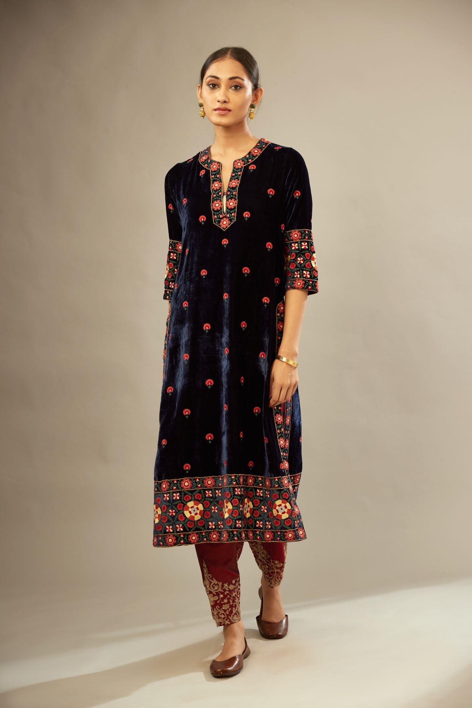 Navy blue silk velvet kurta set with multi colored big embroidered boota and border at hem, detailed with single zardosi work.