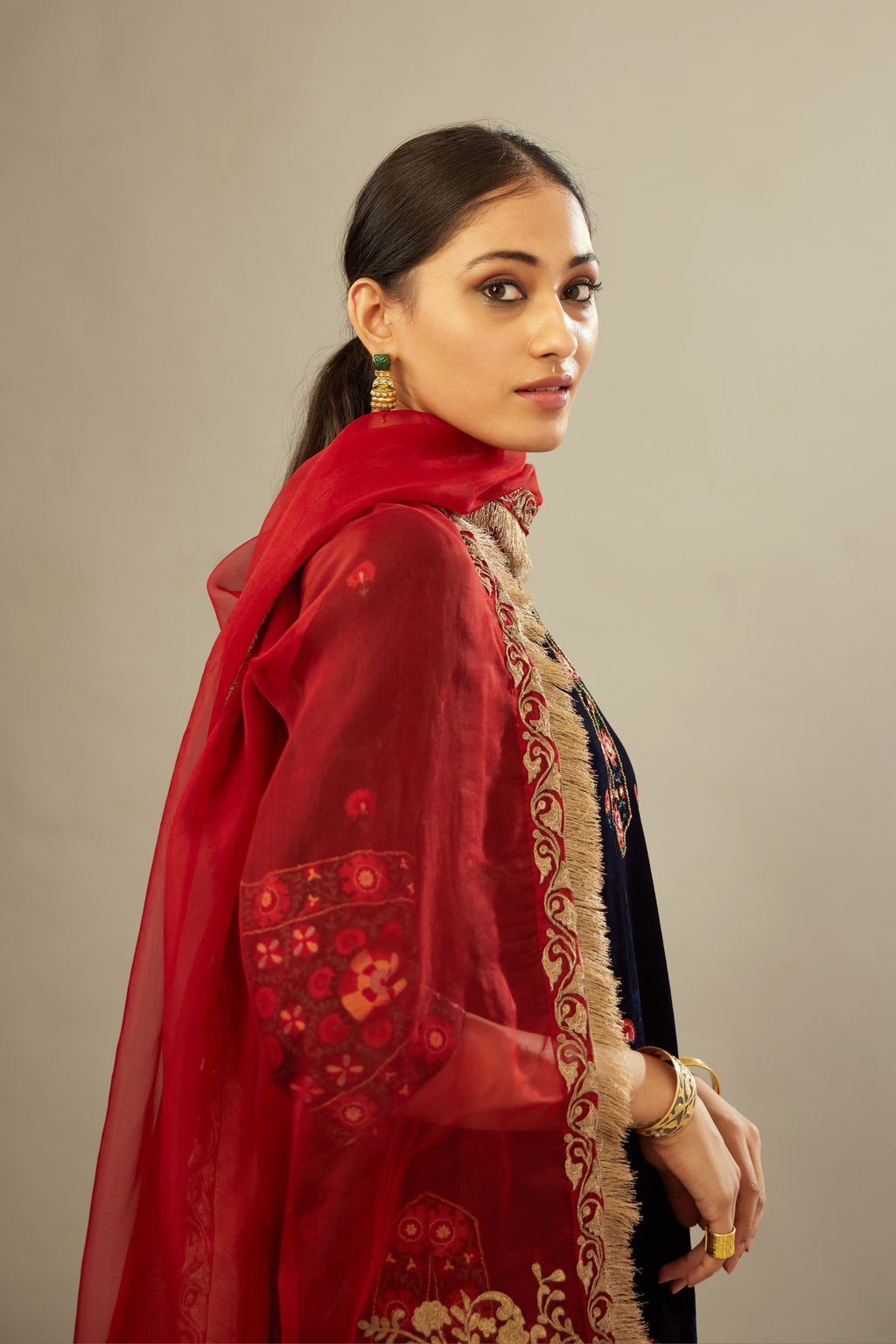 Maroon silk organza dupatta with light gold dori embroidered border and bootas at all four corners.
