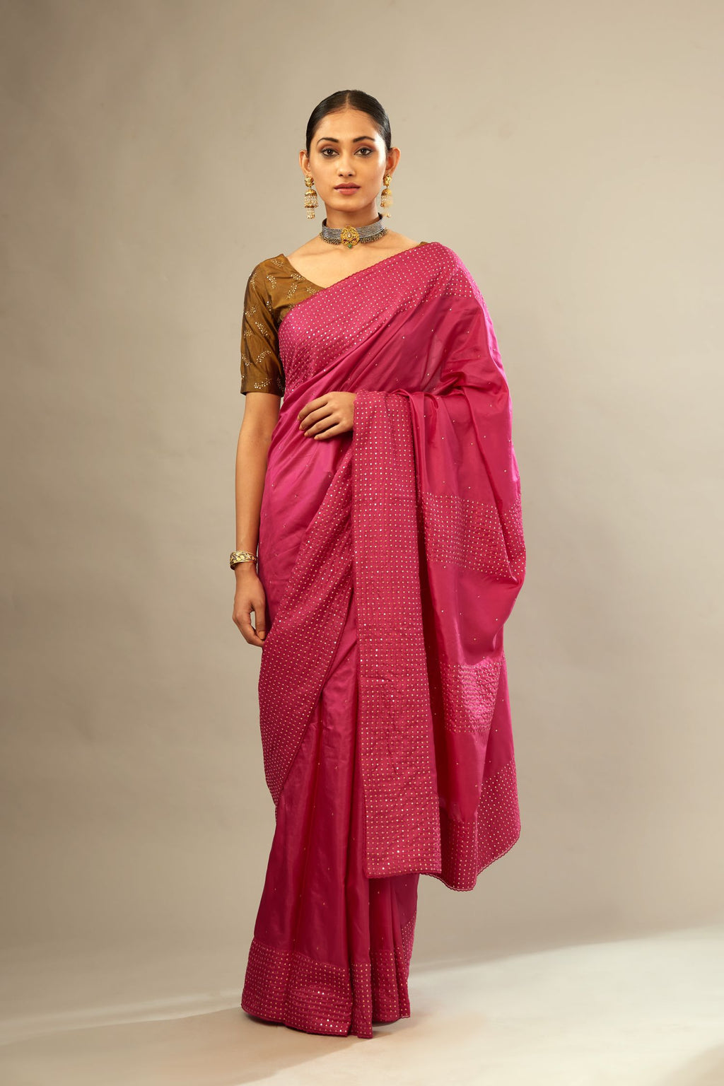 Jazzberry jam silk saree set with a broad border of hand embroidered geometrically aligned sequins and three horizontal bands at the pallu.